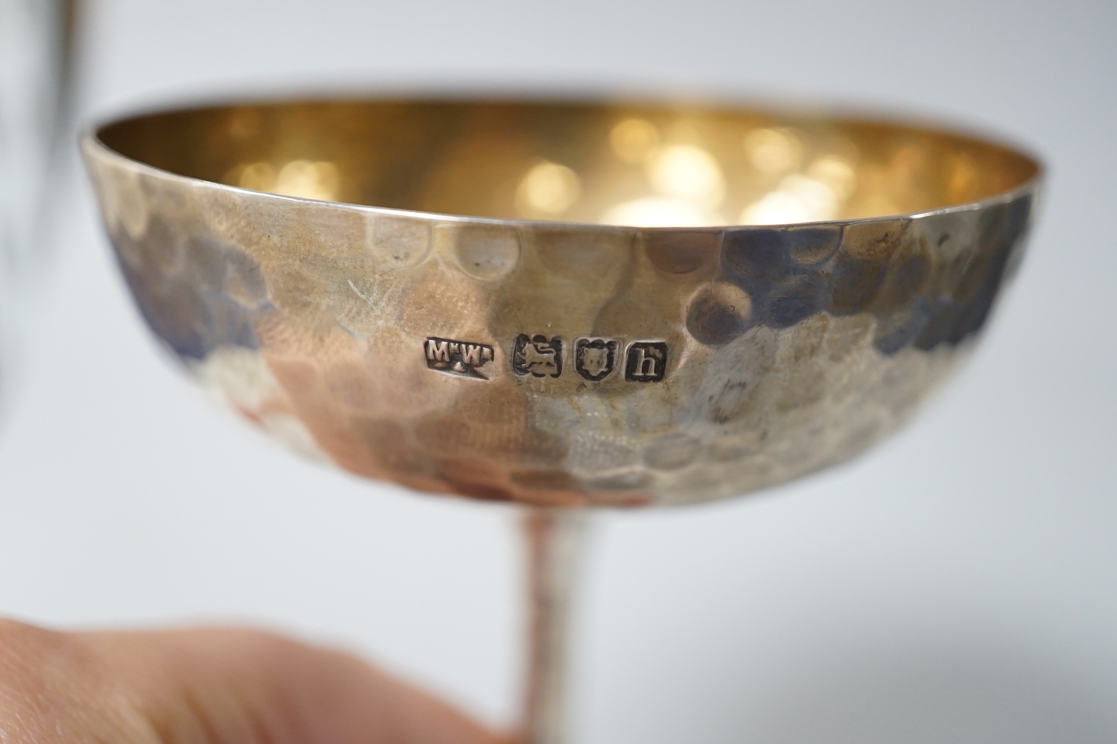 An Edwardian planished silver champagne coupe, makers Mappin & Webb, London 1903, 145 grams